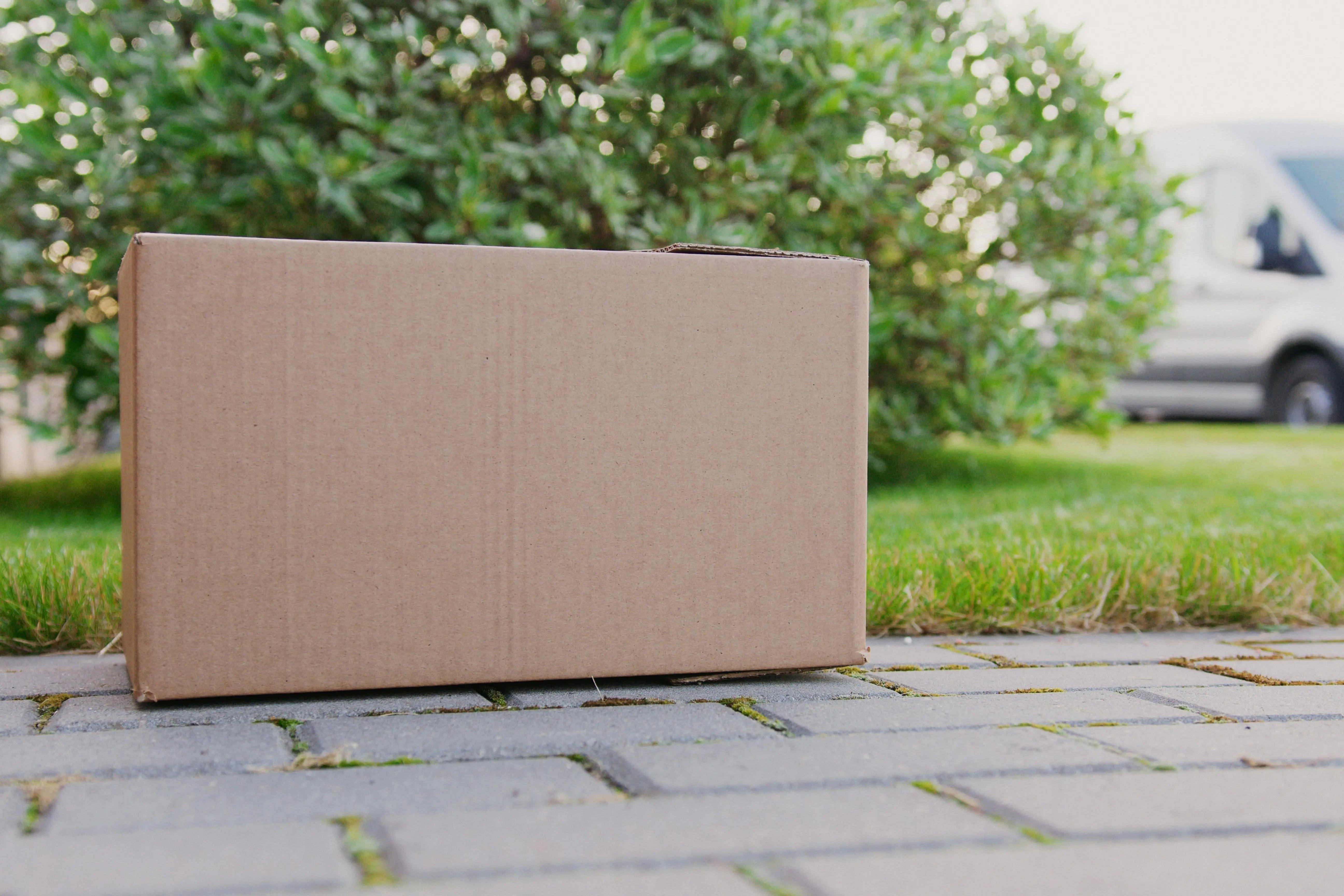 a box in front of a porch of a house