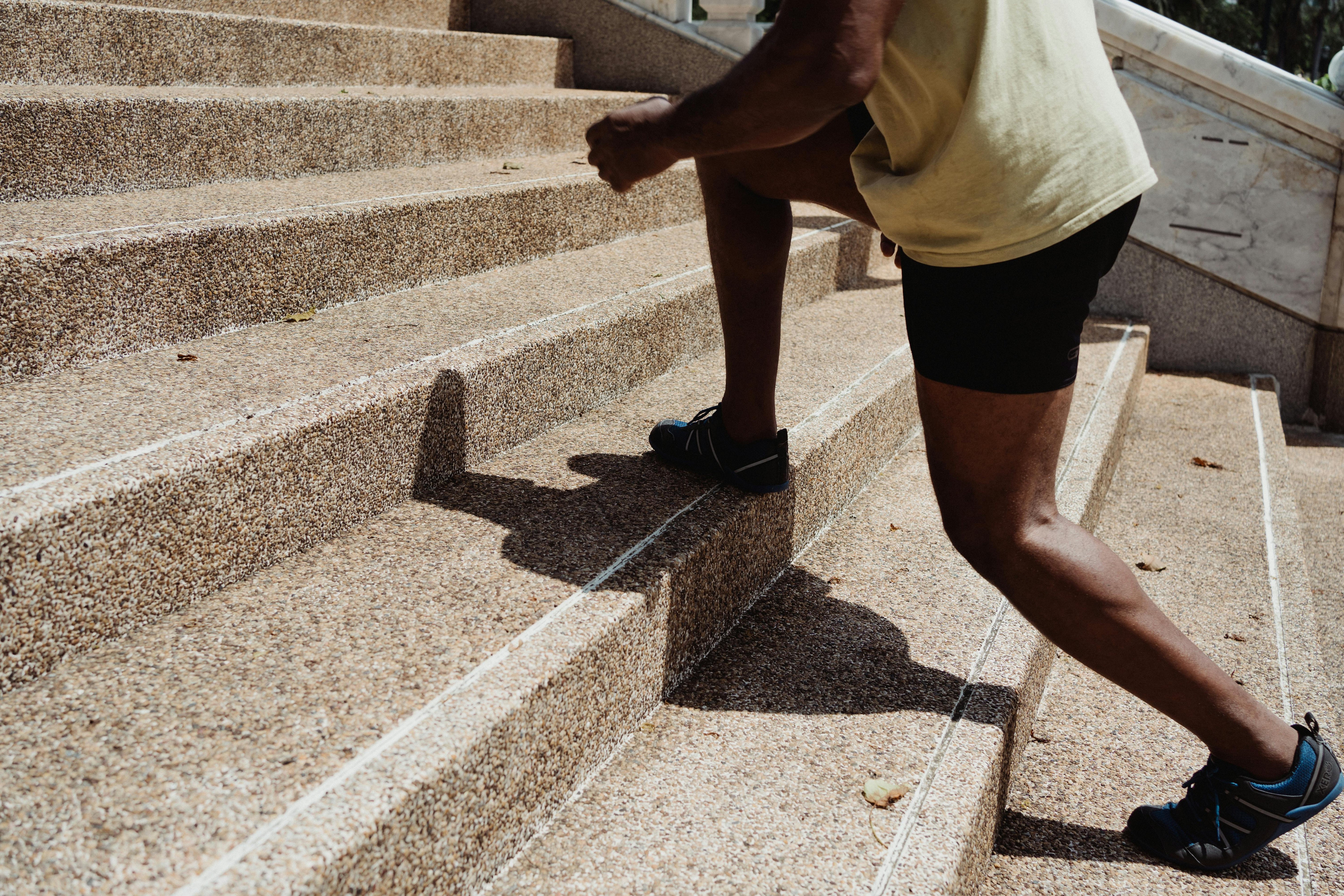person climbing a flight of stairs