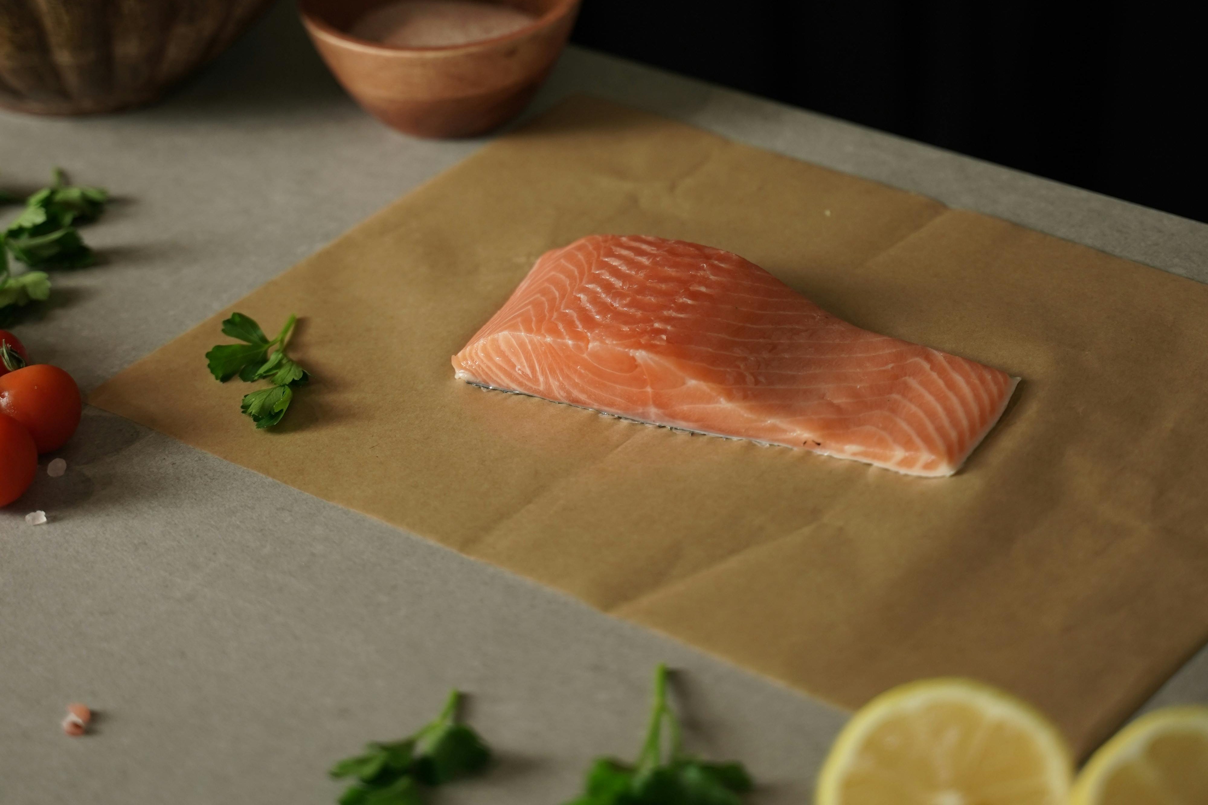 a piece of salmon on a cutting board