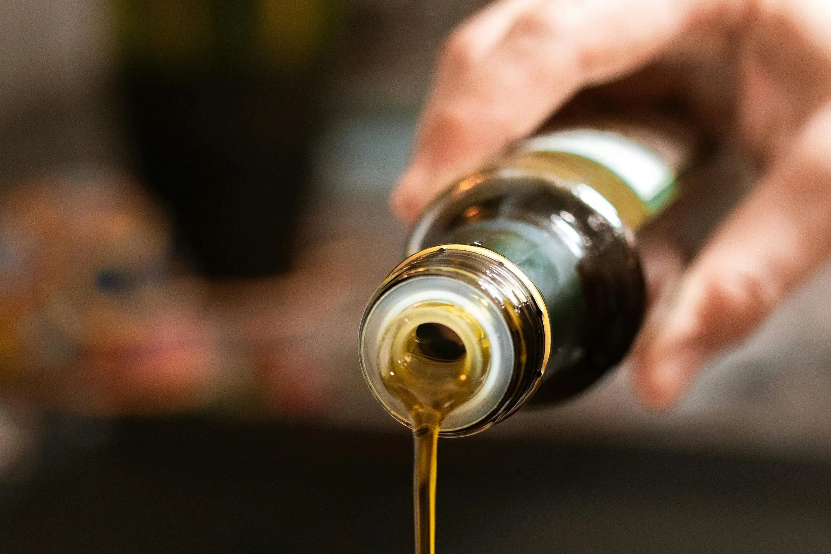 a person pouring oil