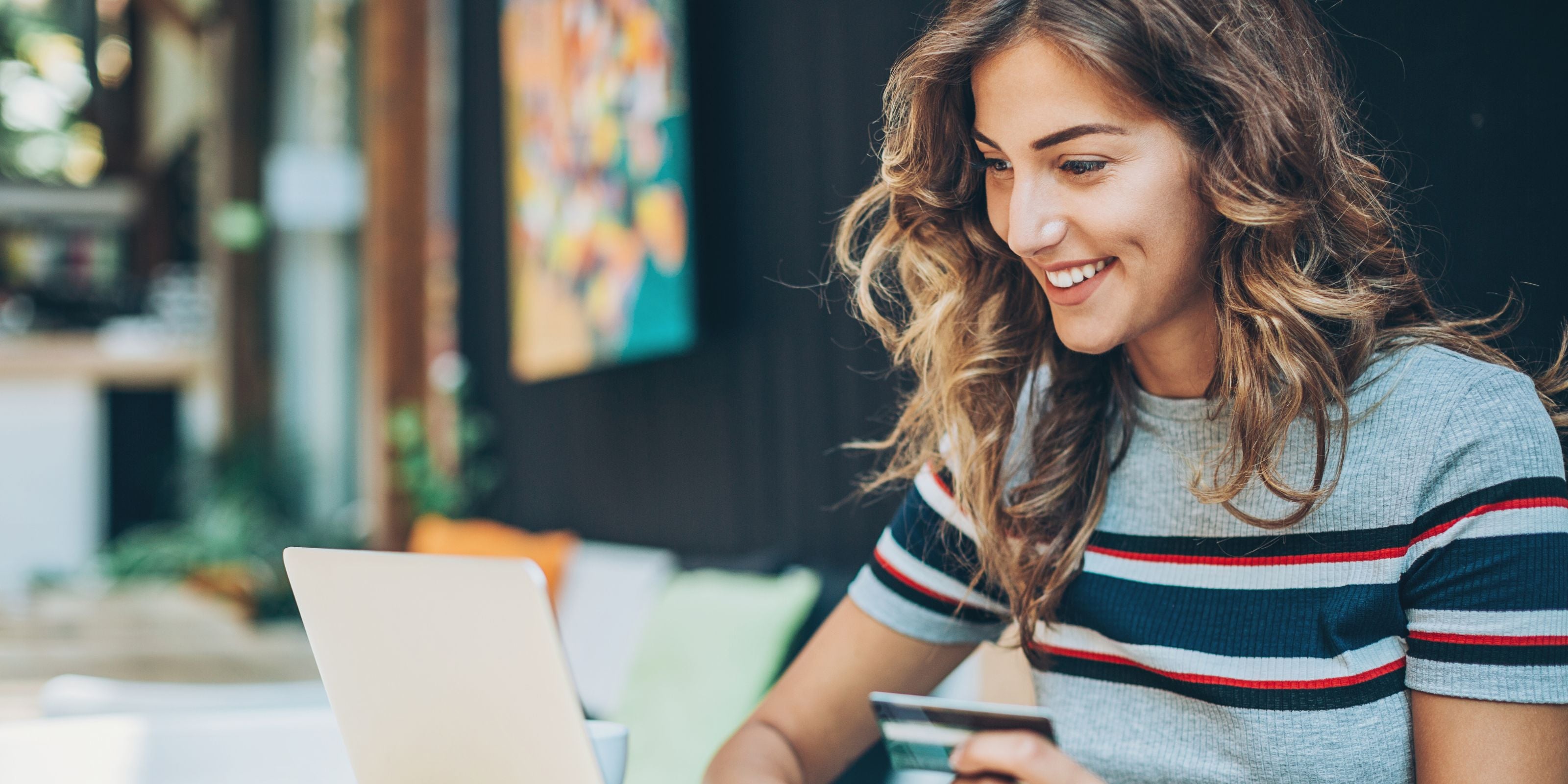 Woman using a laptop in a casual setting