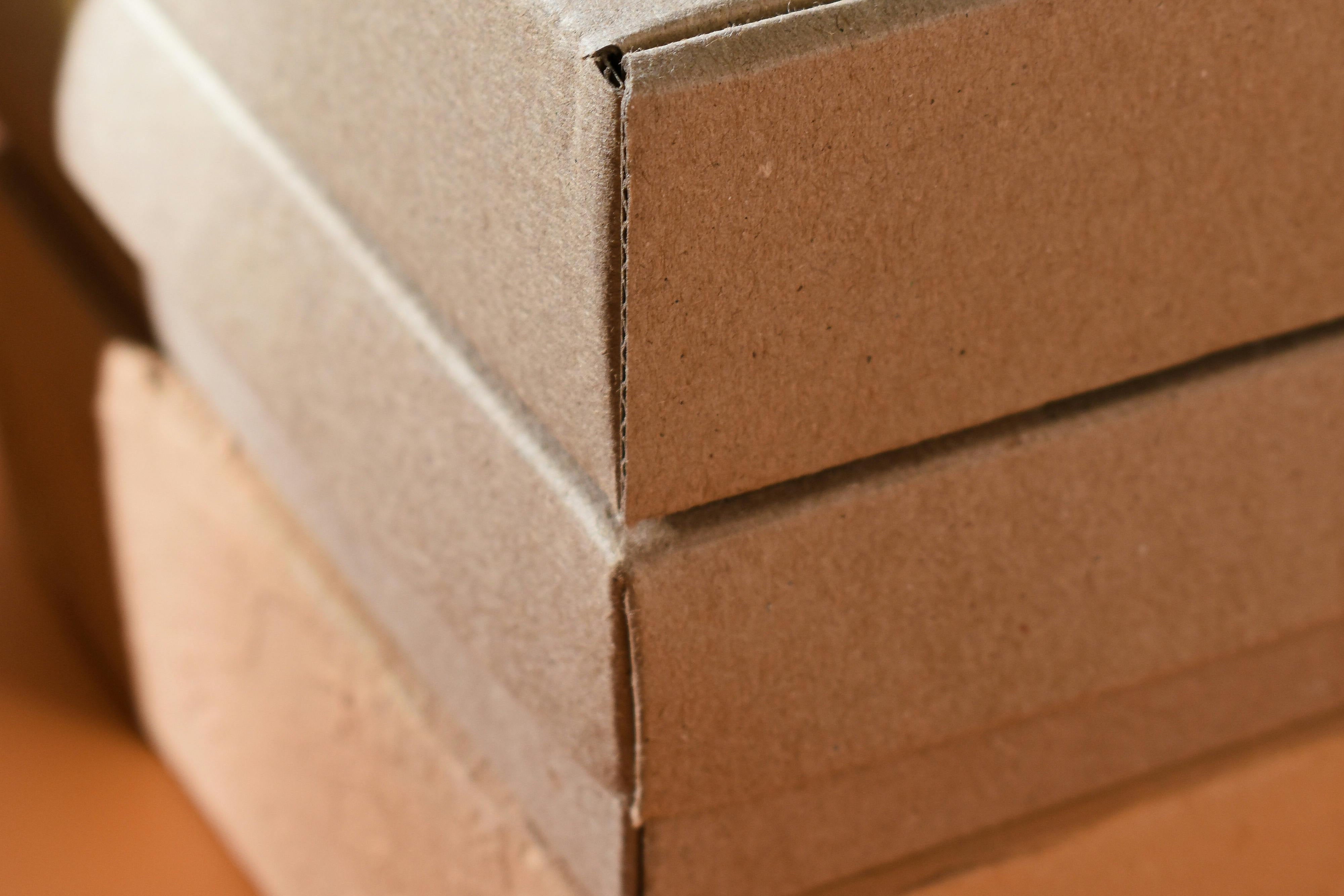 2 boxes stacked on orange table