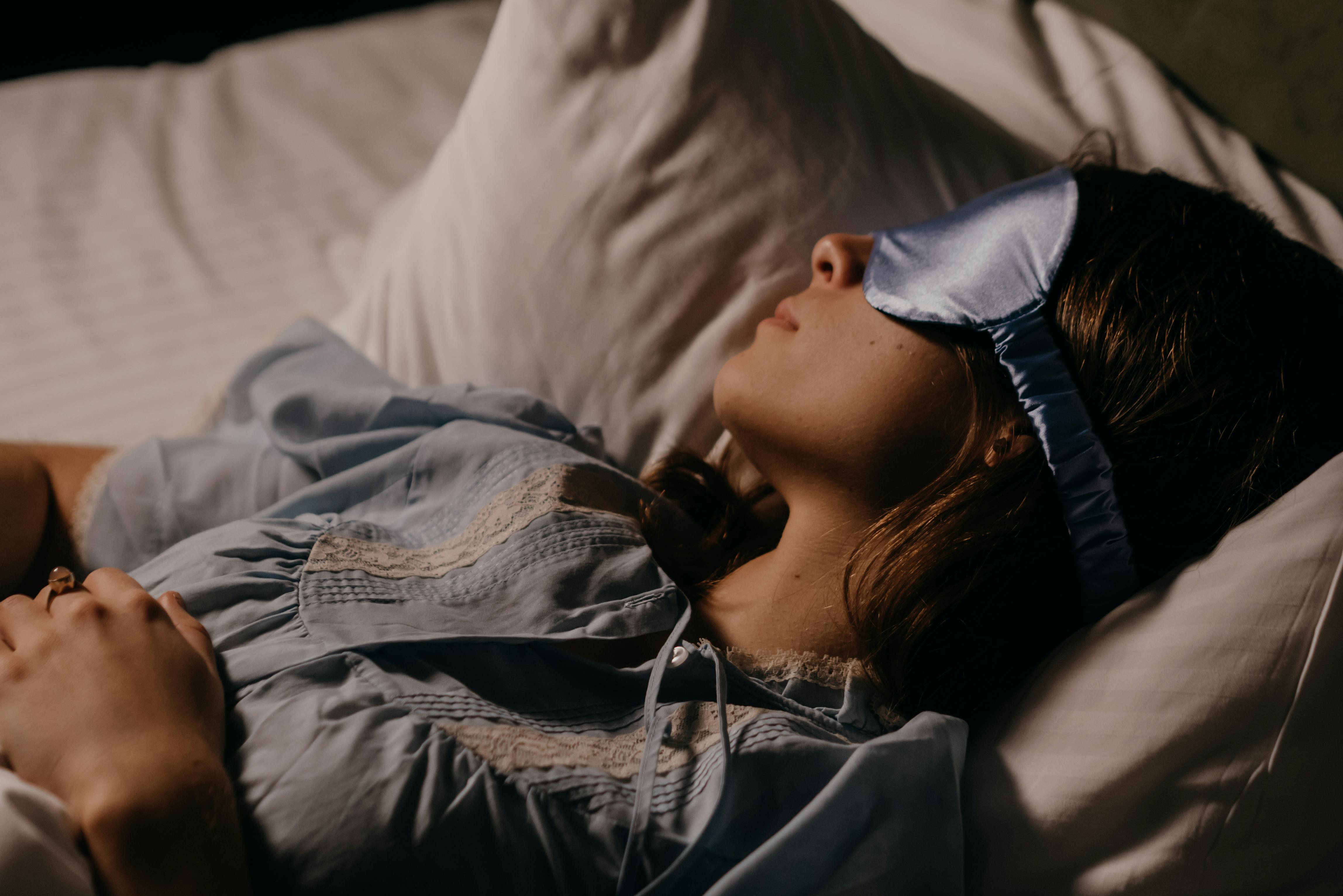 a person sleeping with an eyemask